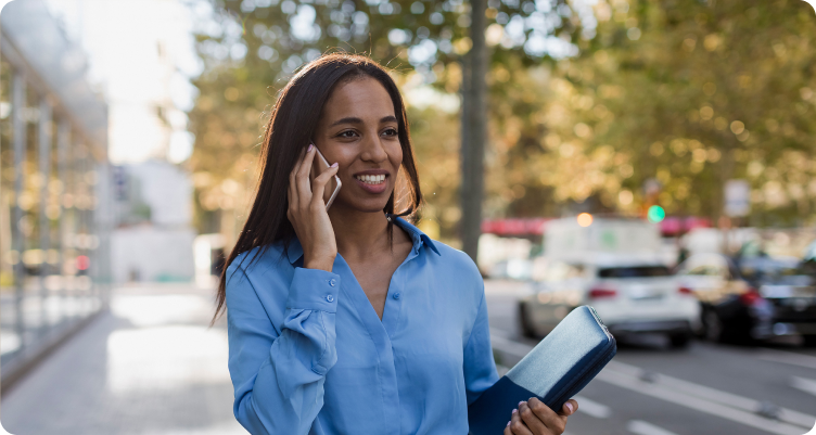 woman on phone smiling.